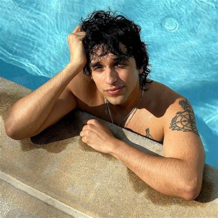 Sebastian Chacon as Warren Rhodes in Malibu Rising